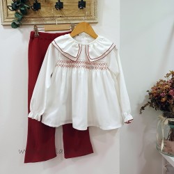 Blusa blanca de niña cuello babydoll